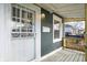 Inviting front porch features detailed railings and a secure entry door at 5350 E 20Th Pl, Indianapolis, IN 46218