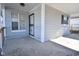 The porch area, complete with gray siding and white railings, offers a relaxing outdoor space at 553 N Traub Ave, Indianapolis, IN 46222