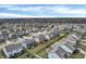 An aerial view of a neighborhood highlighting a mix of home styles, green lawns, and community amenities at 5540 Arrowgrass Ct, Noblesville, IN 46062