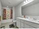 Bathroom featuring double sinks, a shower with a curtain, and a toilet at 5540 Arrowgrass Ct, Noblesville, IN 46062