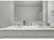A clean bathroom featuring double sinks and a large mirror at 5540 Arrowgrass Ct, Noblesville, IN 46062