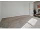 Spacious bedroom featuring neutral carpet, soft natural light, and doorway into a finished hallway at 5540 Arrowgrass Ct, Noblesville, IN 46062
