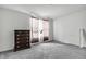 This bedroom has a dresser and natural light coming in from the window at 5540 Arrowgrass Ct, Noblesville, IN 46062