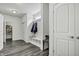 Inviting entryway with coat rack and storage, leading to other rooms in the house at 5540 Arrowgrass Ct, Noblesville, IN 46062