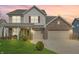 Charming two-story home with a large front yard, two-car garage and covered porch at 5540 Arrowgrass Ct, Noblesville, IN 46062