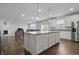 Kitchen area featuring a center island, sleek stainless steel appliances, and an open floor plan at 5540 Arrowgrass Ct, Noblesville, IN 46062