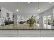 Granite kitchen island with pendant lighting, offers casual seating and separates kitchen from Gathering room at 5540 Arrowgrass Ct, Noblesville, IN 46062