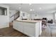 Bright open kitchen with an island, eat in table, stainless steel appliances, and an open floorplan at 5540 Arrowgrass Ct, Noblesville, IN 46062