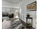 Open-concept living room with hardwood floors, stylish rugs, and a view of the backyard at 5540 Arrowgrass Ct, Noblesville, IN 46062