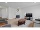 Spacious living room featuring a fireplace, modern furnishings, and ample natural light at 5540 Arrowgrass Ct, Noblesville, IN 46062