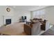 Comfortable living room with a fireplace, large windows, and cozy seating area at 5540 Arrowgrass Ct, Noblesville, IN 46062