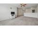 Open concept living room with a ceiling fan and carpeted floors at 5540 Arrowgrass Ct, Noblesville, IN 46062