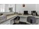 Home office area with built-in desk, cabinets, and ample workspace at 5540 Arrowgrass Ct, Noblesville, IN 46062