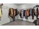 Walk-in closet with ample storage space and carpeted floors at 5540 Arrowgrass Ct, Noblesville, IN 46062