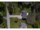 Aerial view of home featuring lush greenery, a well-manicured lawn, and a private backyard at 5836 Andover Rd, Indianapolis, IN 46220