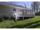 This home features a cozy back deck and steps to the yard, perfect for outdoor relaxing and entertaining at 5836 Andover Rd, Indianapolis, IN 46220