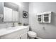 Cozy bathroom featuring modern fixtures, a vanity with a large mirror, and fresh towels at 5836 Andover Rd, Indianapolis, IN 46220