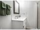 Bright bathroom featuring a vanity with undermount sink, framed mirror and white subway tile backsplash at 5836 Andover Rd, Indianapolis, IN 46220