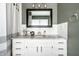 Bathroom featuring a stylish vanity with white cabinets and granite counters at 5836 Andover Rd, Indianapolis, IN 46220