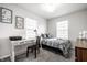 Bright bedroom featuring a cozy bed, modern decor, and ample natural light at 5836 Andover Rd, Indianapolis, IN 46220