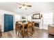 Dining room features an inviting table setting, a fireplace and natural light at 5836 Andover Rd, Indianapolis, IN 46220