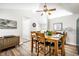 Inviting dining area with a wooden table, comfortable seating, and contemporary decor at 5836 Andover Rd, Indianapolis, IN 46220