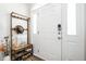 Stylish entryway featuring a coat rack, and white door at 5836 Andover Rd, Indianapolis, IN 46220