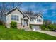 Charming home with two-car garage, white trim, front lawn, and well-maintained landscaping at 5836 Andover Rd, Indianapolis, IN 46220
