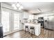 Modern kitchen boasts stainless steel appliances, granite countertops, and ample natural light at 5836 Andover Rd, Indianapolis, IN 46220