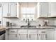 Kitchen view featuring granite countertops, subway tile backsplash, and modern fixtures at 5836 Andover Rd, Indianapolis, IN 46220