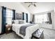 Bright and airy main bedroom featuring a window seat and stylish decor at 5836 Andover Rd, Indianapolis, IN 46220