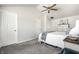 Bright and airy main bedroom featuring neutral decor and comfortable carpet at 5836 Andover Rd, Indianapolis, IN 46220