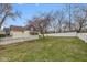Spacious backyard with garden beds and white fence at 602 Prospect St, Indianapolis, IN 46203