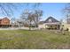 Large backyard with white picket fence, patio area, and fire pit at 602 Prospect St, Indianapolis, IN 46203