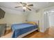 Cozy bedroom featuring a ceiling fan, hardwood floors, and neutral walls at 602 Prospect St, Indianapolis, IN 46203