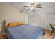 Bedroom with hardwood floors, ceiling fan, closet doors, and great natural light at 602 Prospect St, Indianapolis, IN 46203