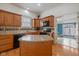 Bright kitchen featuring wooden cabinets, granite countertops, and a view into an adjacent room at 602 Prospect St, Indianapolis, IN 46203