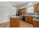 Functional kitchen with wooden cabinets, granite countertops, and a central island for added workspace at 602 Prospect St, Indianapolis, IN 46203