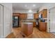 Spacious kitchen with an island, granite countertops, and wood cabinets, providing ample storage and workspace at 602 Prospect St, Indianapolis, IN 46203