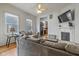 Inviting living room with a fireplace, hardwood floors, and plenty of natural light from large windows at 602 Prospect St, Indianapolis, IN 46203