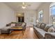Spacious living room with two sofas, hardwood floors, and a view of the front porch through a glass door at 602 Prospect St, Indianapolis, IN 46203