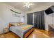 Comfortable bedroom with hardwood floors, a ceiling fan, and ample natural light at 602 Prospect St, Indianapolis, IN 46203