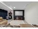 Finished basement with a large projector screen and a comfortable leather sofa at 6043 Acorn Dr, Columbus, IN 47201