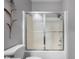 Close-up of tub and shower with framed sliding shower doors at 6043 Acorn Dr, Columbus, IN 47201