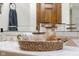 Bathroom vanity with decorative containers, neutral decor and tile backsplash at 6043 Acorn Dr, Columbus, IN 47201