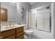 Neutral bathroom with framed shower doors, single vanity, and stylish decor at 6043 Acorn Dr, Columbus, IN 47201