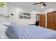 A serene bedroom offers a ceiling fan and a dedicated study area with a desk, enhancing functionality at 6043 Acorn Dr, Columbus, IN 47201