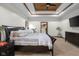 Primary bedroom featuring a coffered wood ceiling, carpet, and ensuite closet at 6043 Acorn Dr, Columbus, IN 47201