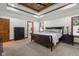 Cozy bedroom featuring a neutral palette, wood trim, and an ensuite bathroom entrance at 6043 Acorn Dr, Columbus, IN 47201