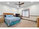 Comfortable bedroom with ceiling fan, work desk, and a window to let in sunlight at 6043 Acorn Dr, Columbus, IN 47201